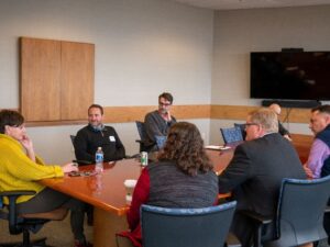 attendees sitting around table