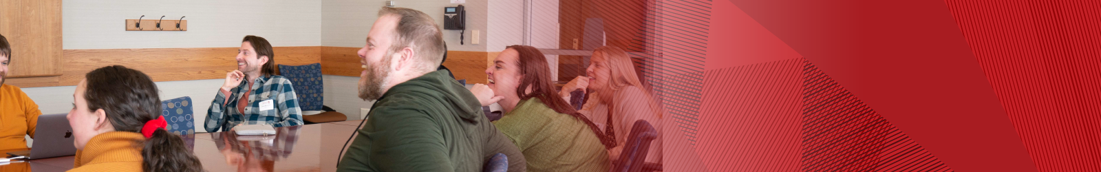 participants in a peer group meeting sitting at a table